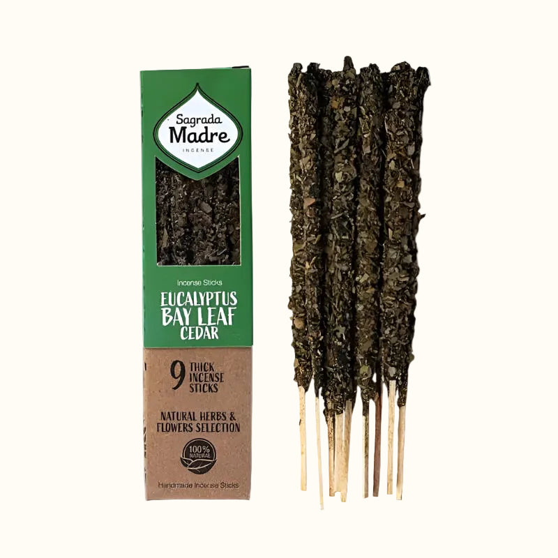 Sticks of Sagrada Madre herbal incense, featuring Eucalyptus, Bay Leaf, and Cedar, with a green and white color scheme.
